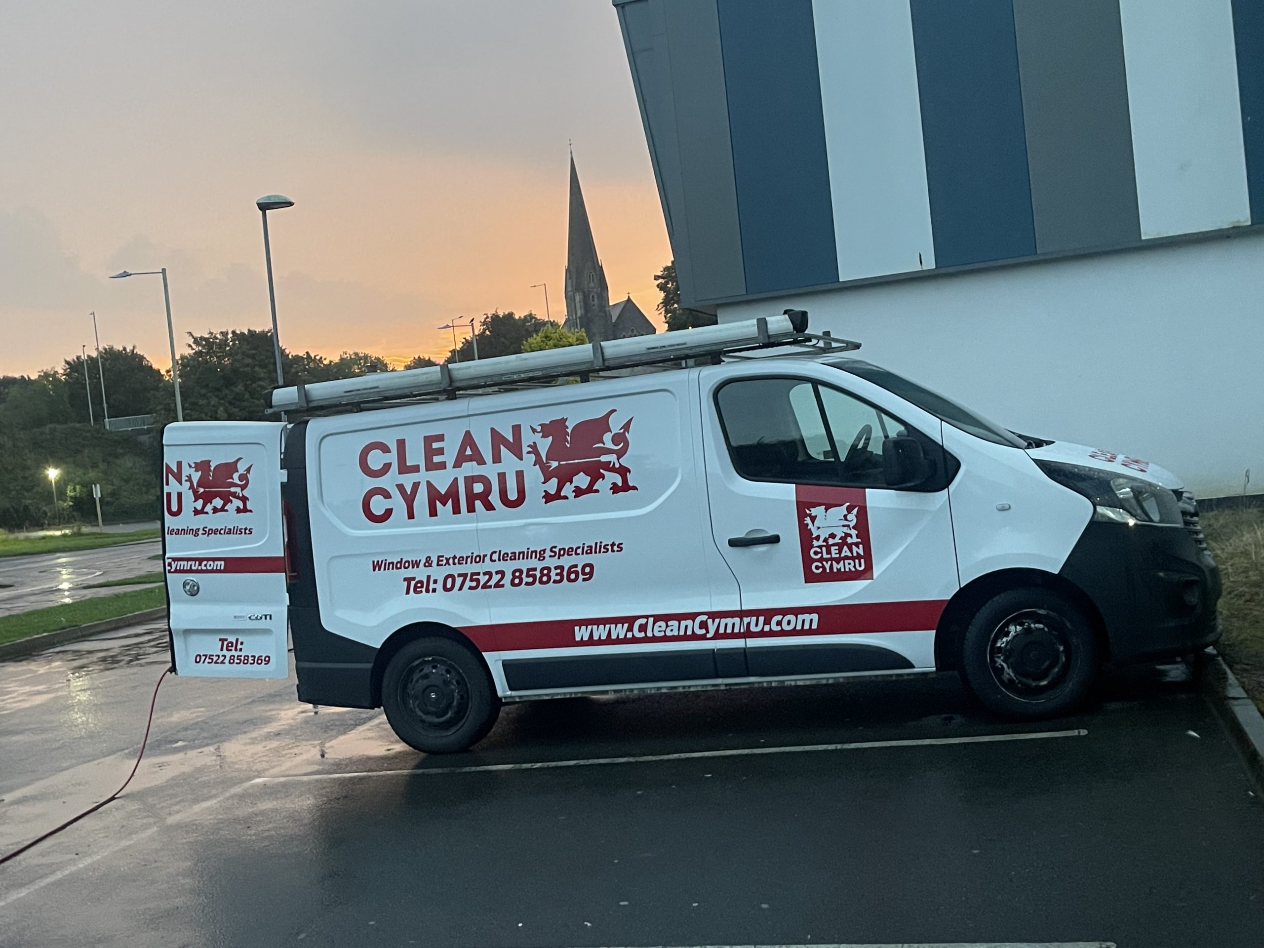 Professional Window Cleaning in Bridgend. Clean Cymru Van outside The Bridgend Life Centre during some commercial windoe cleaning.